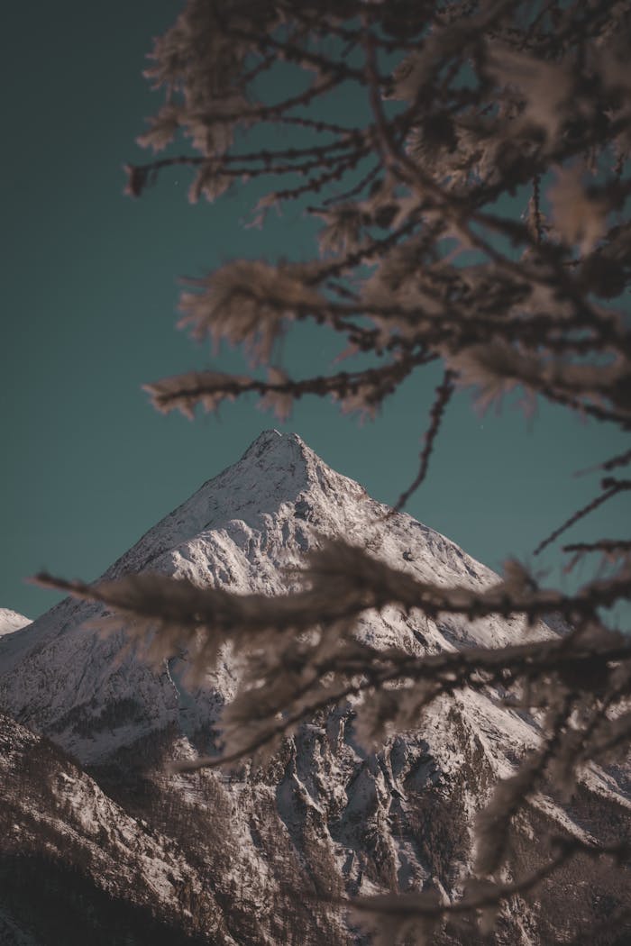 Breathtaking view of snow-capped mountain peaks in Saas-Fee, Switzerland during winter.